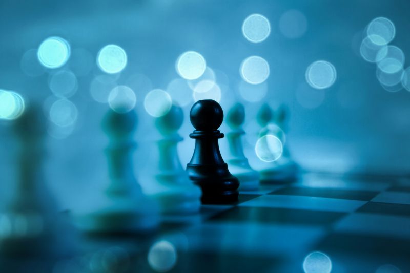 Black pawn on a chess board